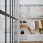 white bath towel on white wooden cabinet