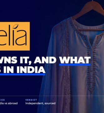 Aurelia brand audit by FashionAudit: Aurelia logo over an elegant pastel kurta set with gota detailing on a wooden hanger