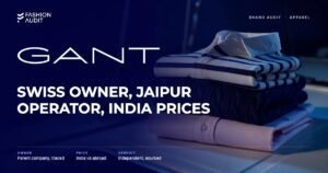 GANT brand audit by FashionAudit: GANT logo and the headline “Swiss Owner, Jaipur Operator, India Prices” over a folded pastel oxford shirt and a cable-knit cotton sweater