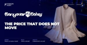 Manyavar brand audit by FashionAudit: Manyavar logo over a groom's ivory sherwani with a dupatta and juttis on a festive stage